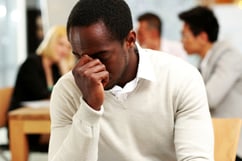 African American businessman tired in office