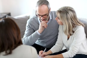Senior couple meeting financial adviser for investment