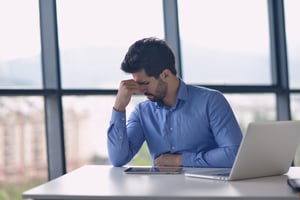 Young business man with problems and stress in the office-1