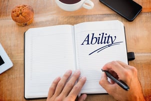The word ability against man writing notes on diary