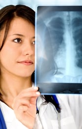 female doctor looking at a lungs or torso xray-1